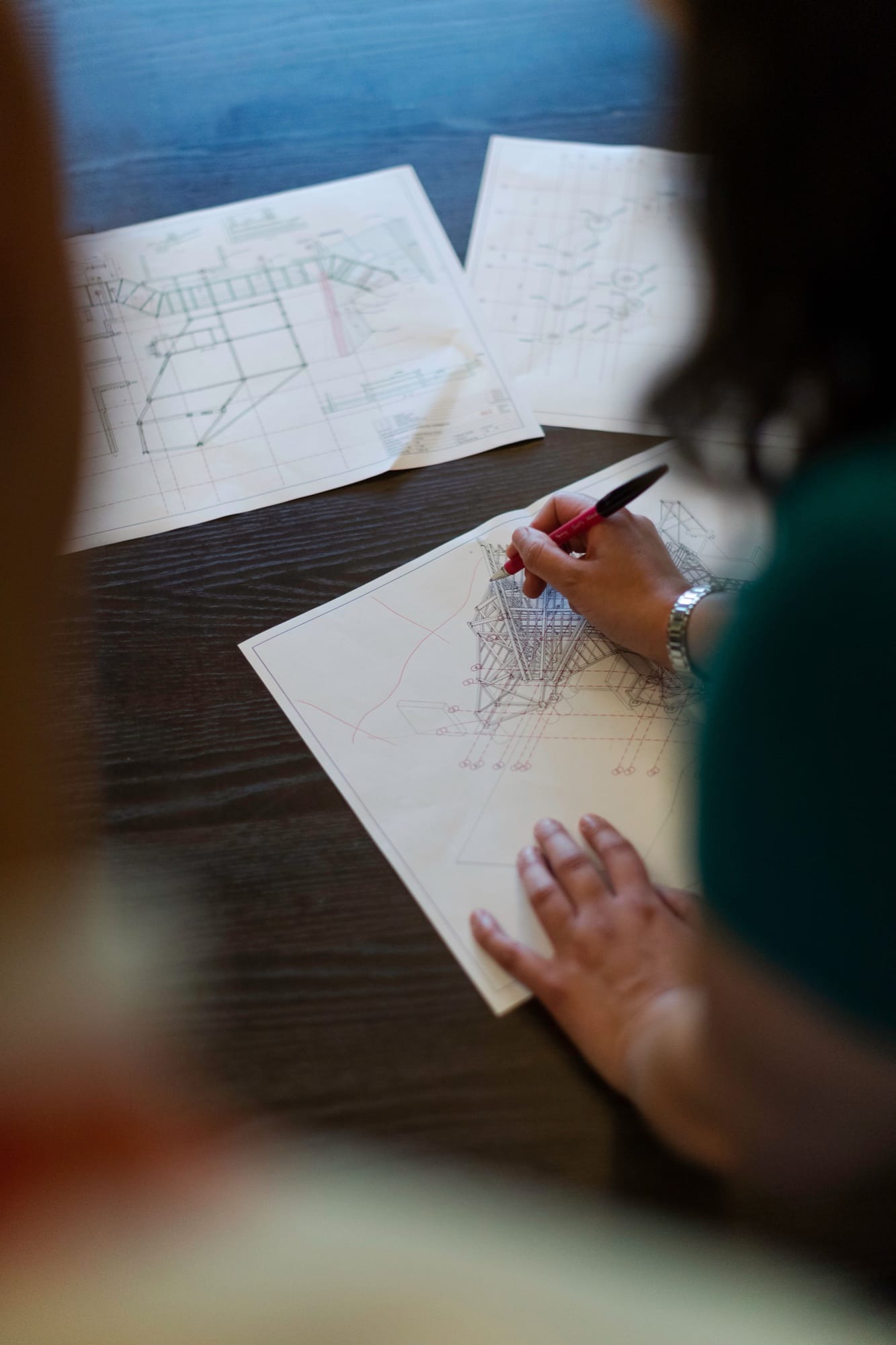 Engineer marking up technical drawings