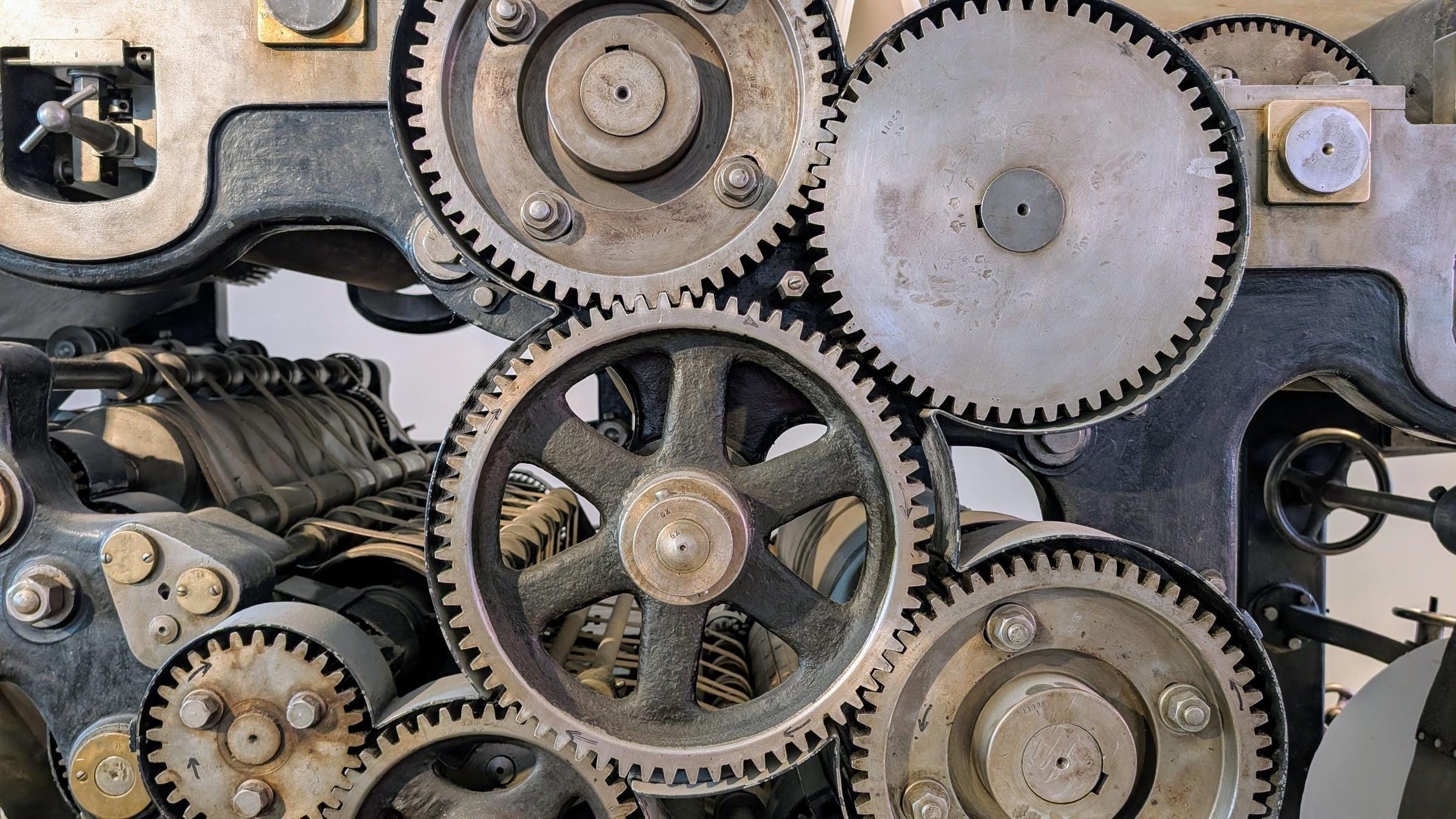 Meshed gear train inside a machine, cast iron and steel